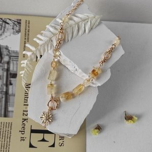 Колье с цитрином в форме столбиков с кулоном солнце