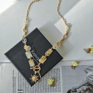 Колье с цитрином в форме столбиков с кулоном солнце
