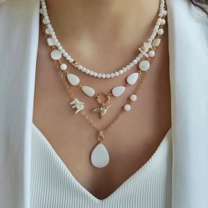 Сет из перламутра и белого коралла в позолоченой фурнитуре