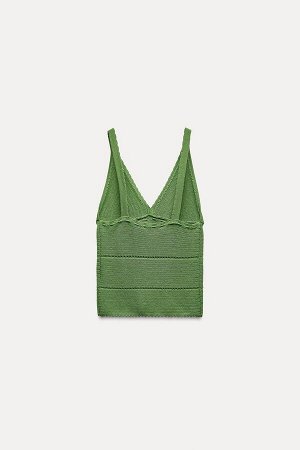 Топ Цвет как на первом фото ТРИКОТАЖНЫЙ ТОП ПУАНТЕЛЬ (POINTELLE-STRICKTOP) Короткий топ с V-образным вырезом и узкими бретелями. Шнуровка такого же цвета спереди. СОСТАВ МАТЕРИАЛА, ИНСТРУКЦИИ ПО УХОДУ