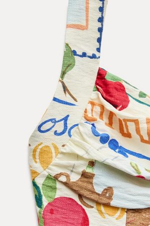 Топ Цвет как на первом фото УКОРОЧЕННЫЙ ТОП С ПРИНТОМ (CROP-TOP MIT PRINT) Короткий топ с прямым вырезом, рюшами и широкими бретелями на пуговицах сзади. Присборенная вставка на спине. СОСТАВ МАТЕРИАЛ