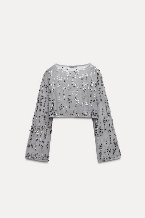 Топ Цвет как на первом фото Укороченный топ из тюля с пайетками (CROPPED-TOP AUS T?LL MIT PAILLETTEN) Слегка прозрачный топ с круглым вырезом и длинными рукавами. Аппликация из контрастных по цвету па