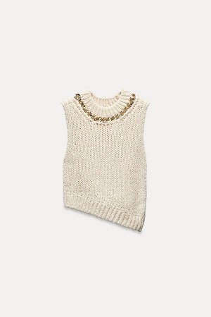 Топ Цвет как на первом фото ТРИКОТАЖНЫЙ ЖИЛЕТ С ЦЕПЬЮ (STRICKWESTE MIT KETTE) Вязаный свитер без рукавов с круглым вырезом, золотой цепочкой и ребристыми манжетами. Асимметричный подол. СОСТАВ МАТЕРИА