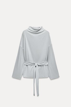 Топ Цвет как на первом фото ДРАПИРОВАННЫЙ ТОП С ПОЯСОМ (DRAPIERTES TOP MIT G?RTEL) Топ с драпированным вырезом и длинными рукавами. Регулируемый ремень из той же ткани с бантом. СОСТАВ МАТЕРИАЛА, ИНСТ