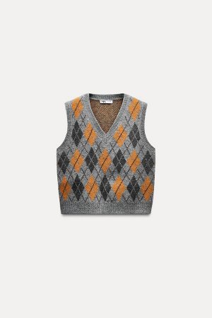 Топ Цвет как на первом фото ЖАККАРДОВЫЙ ТРИКОТАЖНЫЙ ЖИЛЕТ С АЛМАЗНЫМ УЗОРОМ (JACQUARD-STRICKWESTE MIT RAUTENMUSTER) Кардиган без рукавов с V-образным вырезом. Ребро заканчивается. СОСТАВ МАТЕРИАЛА, ИН