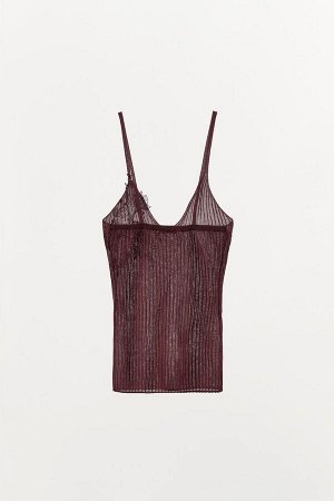 Топ Цвет как на первом фото ТРИКОТАЖНЫЙ ТОП С ВЫШИВКОЙ (STRICKTOP MIT STICKEREI) Слегка прозрачный трикотажный топ в рубчик из смесовой вискозной ткани. V-образный вырез и узкие бретели. Аппликация с 