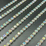Стразовая цепочка серебристая SS12 (3 мм) с прозрачными стразами с радужным AB покрытием.  Цена за 50 см.