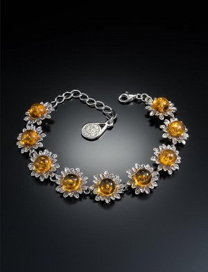 Нарядный браслет, украшенный натуральным цельным янтарём светло-коньячного цвета «Астра»