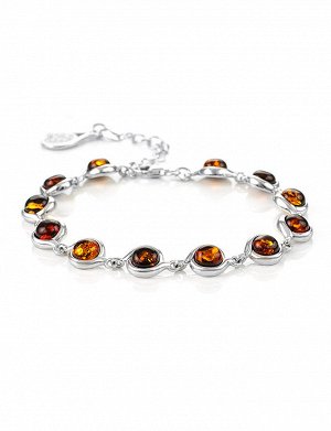 Браслет, украшенный яркими вставками из коньячного янтаря «Ягодки крупные»
