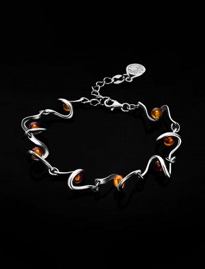 Тонкий браслет, украшенный натуральным цельным янтарём коньячного цвета «Лея»