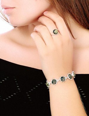 Серебряное кольцо с натуральным искрящимся зеленым янтарем «Сфера»