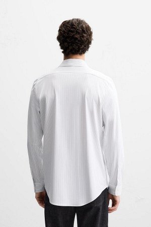 Рубашка ЦВЕТ как на первом фото РУБАШКА ИЗ СТРЕЙЧ-ТЕКСТУРЫ (ELASTISCHES HEMD MIT TEXTUR) Приталенная рубашка из ткани, практически не требующей глажки. Воротник «Виндзор». Длинные рукава с застегивающ