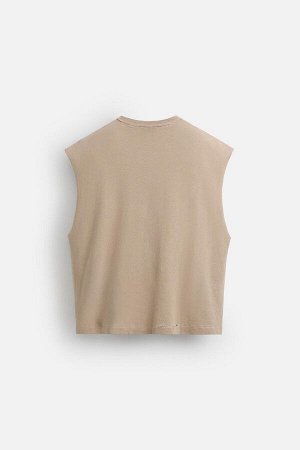 Футбока ЦВЕТ как на первом фото ВЯЗАНАЯ МАЙКА С ПРИНТОМ (GESTRICKTES TANKTOP MIT PRINT) Трикотажная футболка свободного кроя из хлопчатобумажной пряжи. Круглый вырез и без рукавов. Контрастный принт с