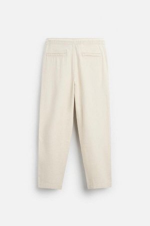 Брюки ЦВЕТ как на первом фото БРЮКИ СВОБОДНОГО КРОЯ С ТЕКСТУРНЫМ РИСУНКОМ (RELAXED-FIT-HOSE MIT STRUKTURMUSTER) Брюки из хлопчатобумажной ткани с фактурным рисунком. Эластичный пояс с завязкой. Боковы