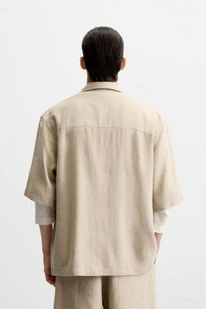 Рубашка ЦВЕТ как на первом фото РУБАШКА OVERSIZE ИЗ ЛЬНА И ВИСКОЗЫ (OVERSIZE-FIT-HEMD AUS LEINEN UND VISKOSE) Рубашка свободного кроя из льна и вискозы. Воротник-боулинг и короткие рукава. Накладной к