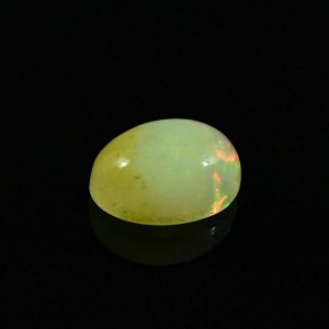 Кабошон натуральный камень опал овал 7*9мм, 1,4ct