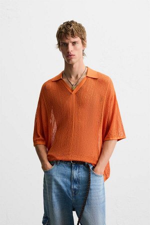 Трикотаж ЦВЕТ как на первом фото Ажурная трикотажная рубашка-поло (POLOSHIRT AUS STRICK MIT AJOURMUSTER) Рубашка-поло свободного кроя из ажурной ткани. Воротник-лацкан с разрезом спереди. Короткие рук