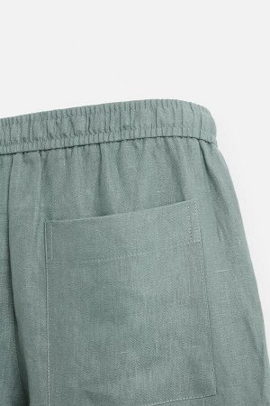 Брюки ЦВЕТ как на первом фото БРЮКИ СТАНДАРТНОГО КРОЯ ИЗ 100% ЛЬНА (REGULAR-FIT-HOSE AUS 100 % LEINEN) Брюки прямого кроя из льняной ткани. Эластичный пояс с завязкой. Декоративные складки спереди. Пе