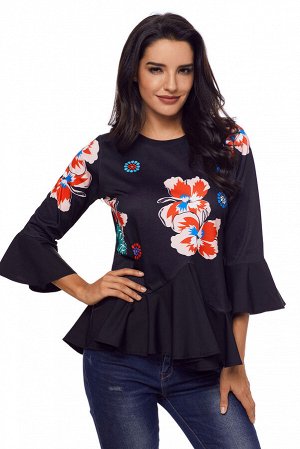 Черная блуза с цветочным узором, баской и воланами на рукавах