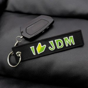 Брелок тканевый с вышивкой «JDM»