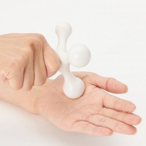 MUJI Hogushi Tetra — компактный массажёр