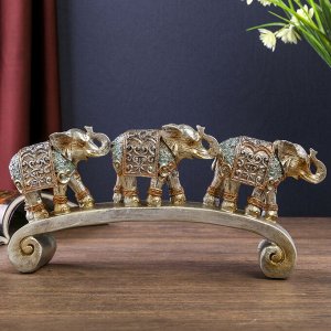 Сувенир полистоун "Серебристые слоны в ажурных бирюзовых попонах на дуге" 12,2х28х5,2 см