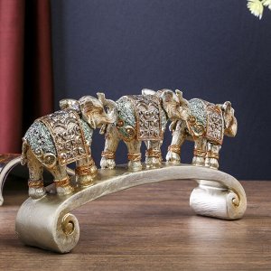 Сувенир полистоун "Серебристые слоны в ажурных бирюзовых попонах на дуге" 12,2х28х5,2 см