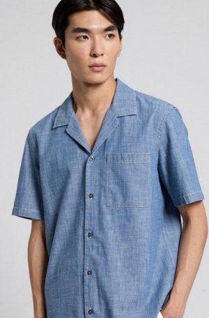 РУБАШКА Tessuto: 100% COTONE
Camp shirt washed chambray
Short set-in sleeves
Camp collar
Chest pocket
Boxy fit with straight bottom
Front buttons fastening
Centre back length: 71,5 cm