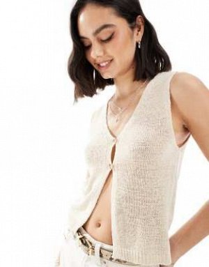 Топ Stradivarius – STR – Жилет в деревенском стиле цвета экрю (Stradivarius – STR – Rustikale Strickweste in Ecru) Топ от Stradivarius * V-образный вырез * Планка на пуговицах * Разрез спереди * Класс