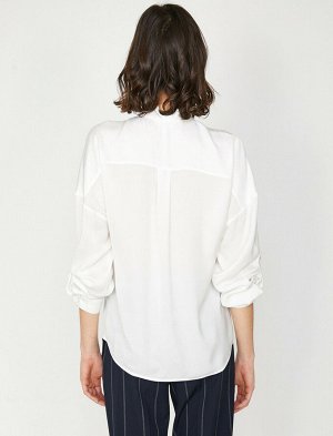 рубашки Материал %100 полиэстер Параметры модели: рост: 177 cm, грудь: 83, талия: 61, бедра: 91 Надет размер: 36