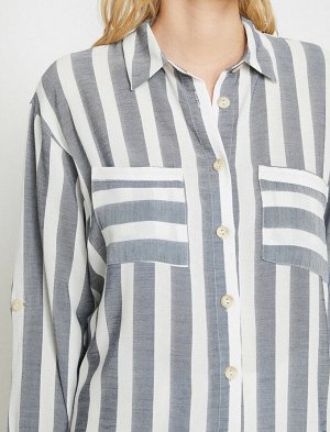 рубашки Материал %100 Вискоз Параметры модели: рост: 176 cm, грудь: 84, талия: 61, бедра: 89 Надет размер: 36