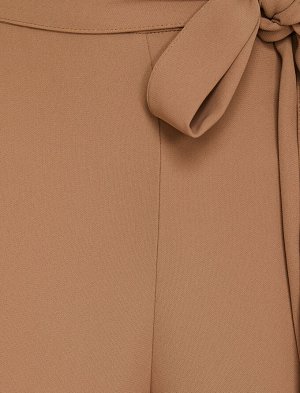 брюки Материал Параметры модели: рост: 176 cm, грудь: 77, талия: 60, бедра: 91 Надет размер: 36