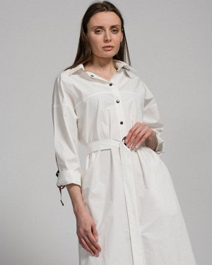 Платье Платье – рубашка из хлопка, со спушенной линией плеча, длинным рукавом, рубашечным воротником, застёжкой-планкой на металлические кнопки, кокеткой по спинке и полочке и тесьмой по спинке и рука