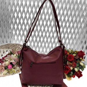 Функциональная сумка-рюкзак Bestar из качественной матовой эко-кожи рубинового цвета.