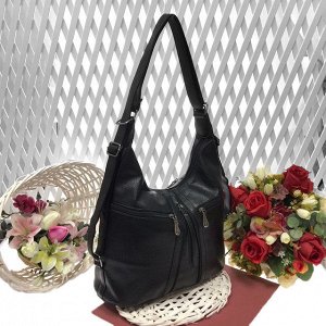 Функциональная сумка-рюкзак Eve из качественной матовой эко-кожи черного цвета.