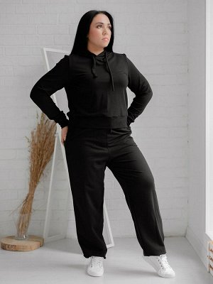 Брюки Описание и параметры
Дизайнерские брюки из футера черного цвета свободного силуэта с боковыми карманами. Пояс на широкой резинке со шнуром. Сзади брюки с кокеткой, низ отделан манжетами. Изделие