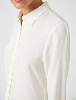 рубашка Материал: %100 вискозыПараметры модели: рост: 176 cm, грудь: 90, талия: 62, бедра: 88 Надет размер: 36