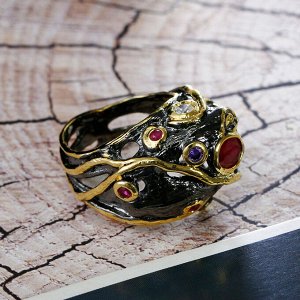 Кольцо 'Черное золото' со вставками из малиновых цирконов