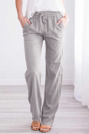 Серые штаны с эластичными поясом на шнурке и карманами