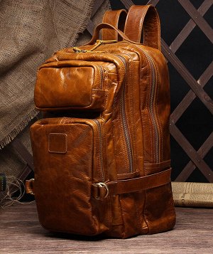Aikhaal Большая многофункциональная  мужская сумка из натуральной кожи с очень вместительными отделениями закрытыми на молнию. С возможностью носить как рюкзак. Впереди объемные карманына молнии. Есть