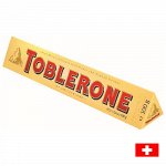 Toblerone milk 100g - Швейцарский шоколад Тоблерон с миндалем и медовыми ирисками
