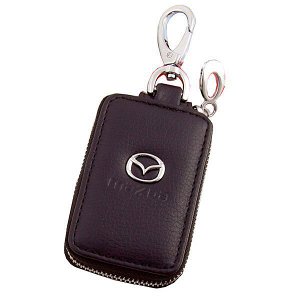 Ключница Ключница кожаная SW Mazda прямоугольная,черная, с молнией - ключница из натуральной кожи, выполнена в черном цвете, закрывается при помощи молнии и имеет овальную форму. На внутренней стороне