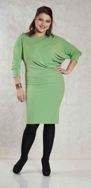 Платье Стильное платье, асимметричного кроя, выполнено из трикотажного полотна травянисто зелёного цвета. Изящный вырез - "лодочка", широкий рукав, длиной 3/4 на манжете. Низ платья заужен, что эффект