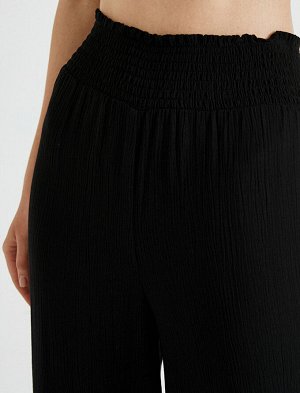 брюки Материал: %100 вискоз Параметры модели: рост: 178 cm, грудь: 80, талия: 58, бедра: 87 Надет размер: 36