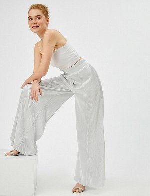 брюки Материал: %100 Полиэстер Параметры модели: рост: 175 cm, грудь: 81, талия: 60, бедра: 88 Надет размер: 36