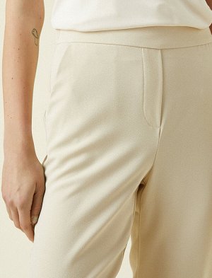 брюки Материал: %100 Полиэстер Параметры модели: рост: 177 cm, грудь: 81, талия: 62, бедра: 90 Надет размер: 36