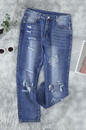 Синие укороченные джинсы с потертостями и разрезами