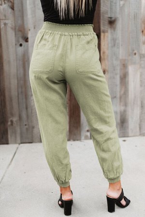 Зеленые джоггеры с эластичной талией на шнуровке и карманами