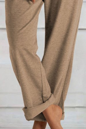 Бежевые штаны свободного кроя с эластичной талией на шнуровке и карманами