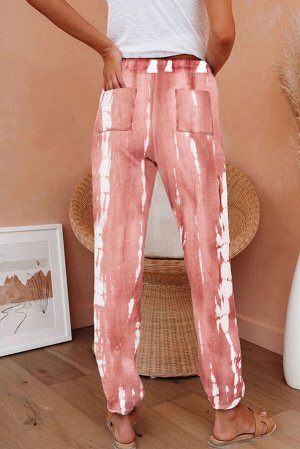 Розовые вязанные джоггеры с карманами и белым красочным принтом